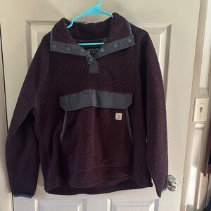 Maroon Carhartt fleece pullover hoodie.